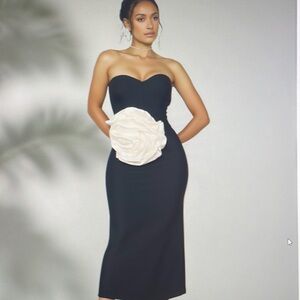 Elegant Black Strapless Dress with White Floral Accent